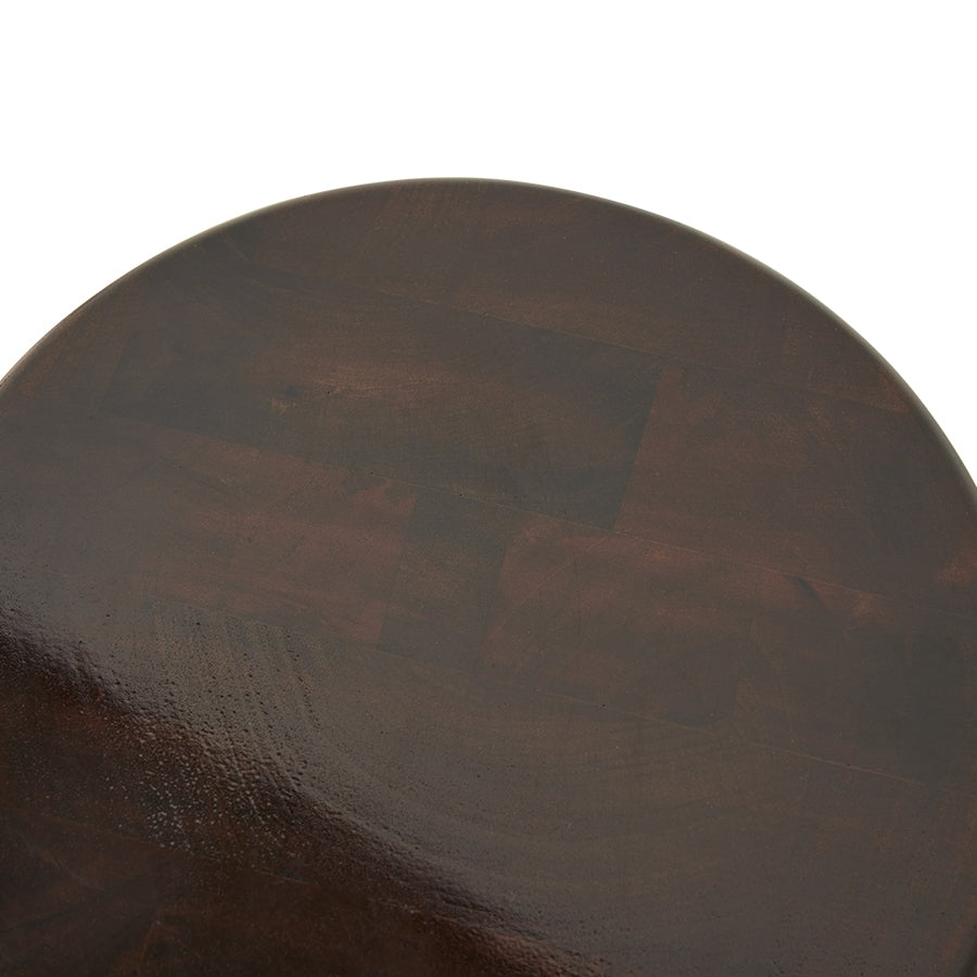 detail of top wooden table stool with a glossy Burgundy color shellack