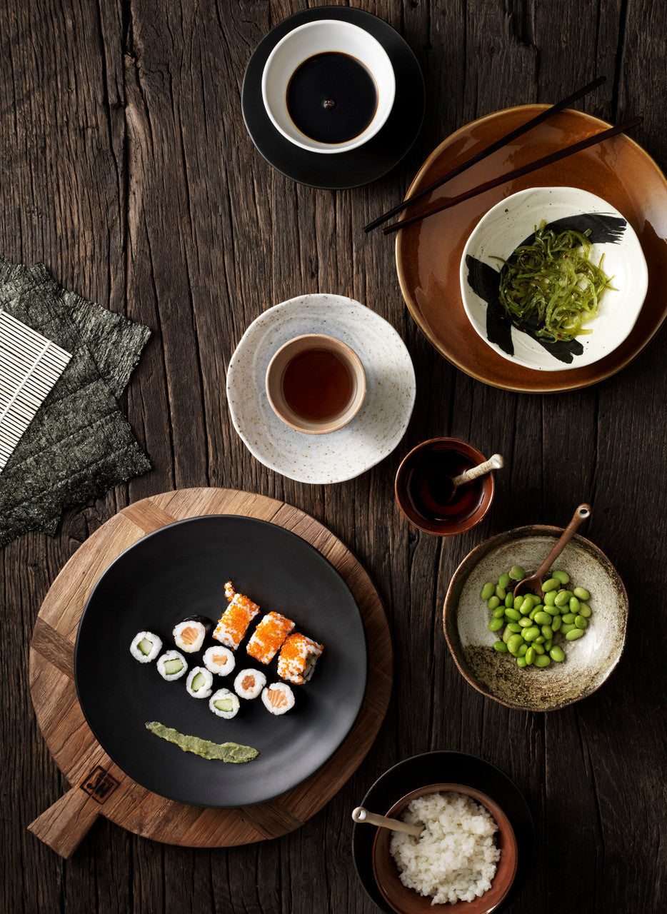 kyoto ceramics with sushi on wooden table