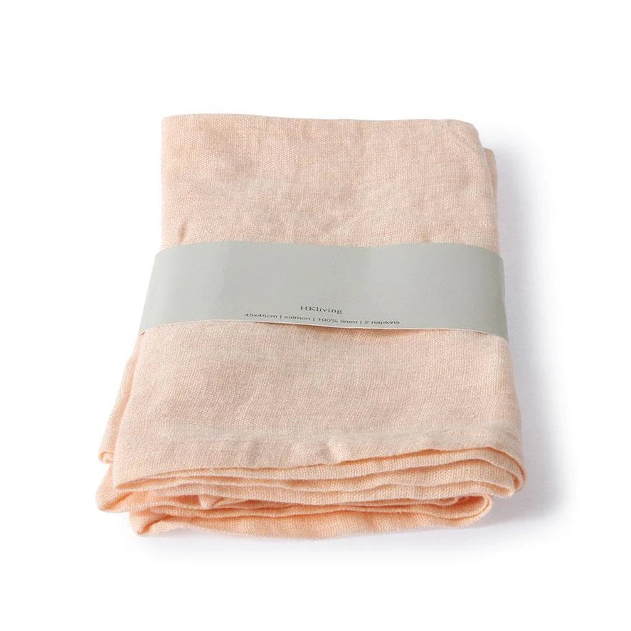salmon colored linen napkins folded