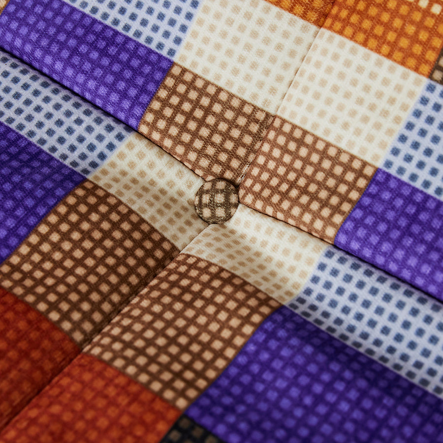 fabric detail of orange purple and black lounge chair