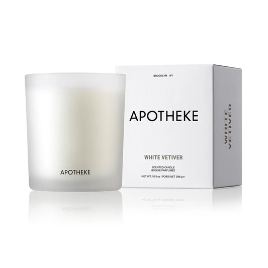 white glass vessel with Apotheke logo and box with white vetiver scented candle on white background
