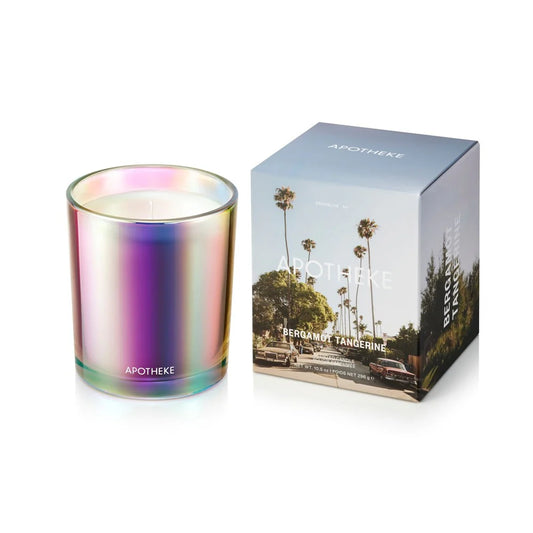 Iridescent candle with Apotheke packaging on a white background