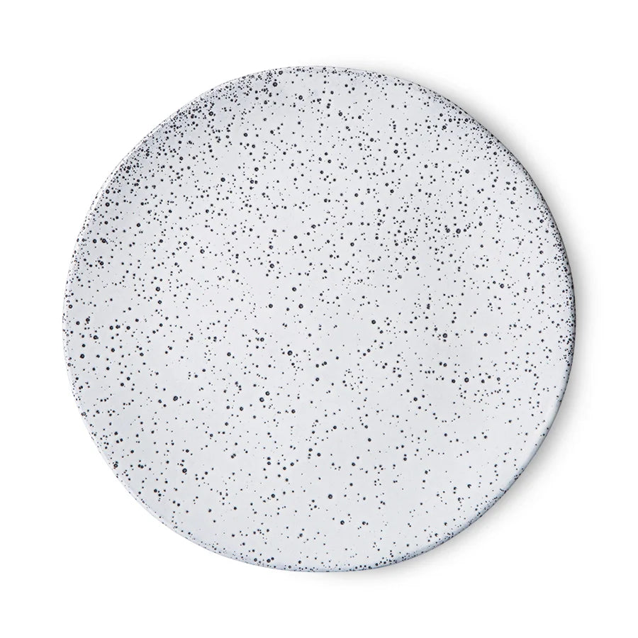 white side plate with dark speckles