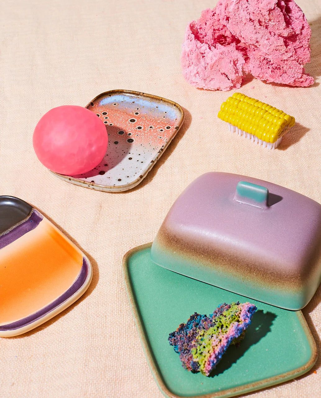 1970 style stoneware trays on a table with small accents