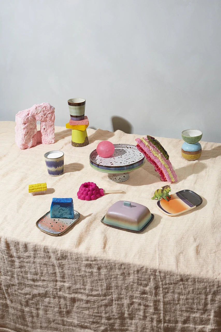 set of 4 stoneware condiment bowls in different pastel colors  on a table with soap and mugs