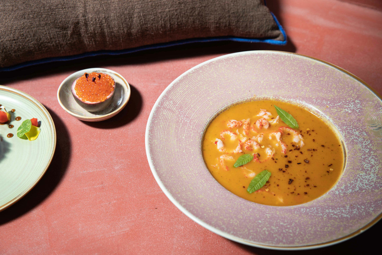 round deep rustic pasta plate with soup