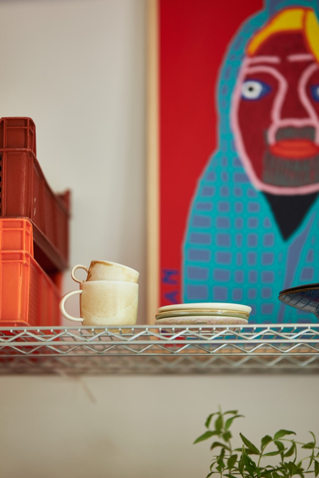 cream and brown rustic coffee mug with ear on a shelf