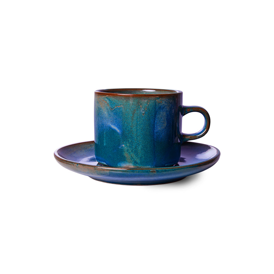 cup and saucer made from porcelain with a rustic blue glazed finish