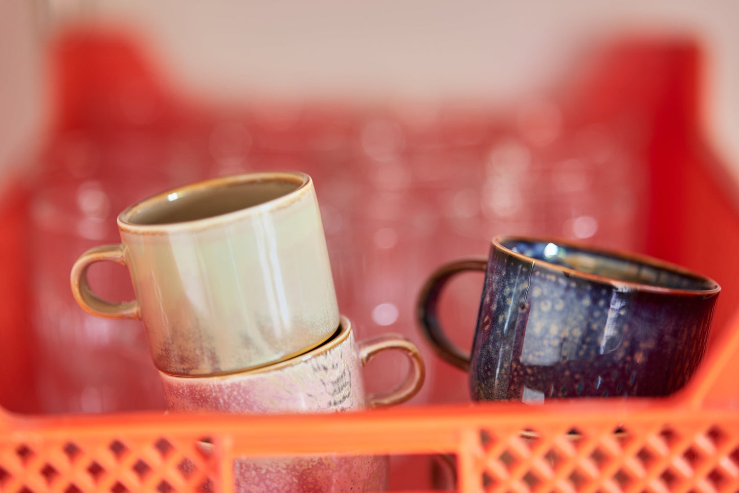 orange crate with cream and brown cup with saucer