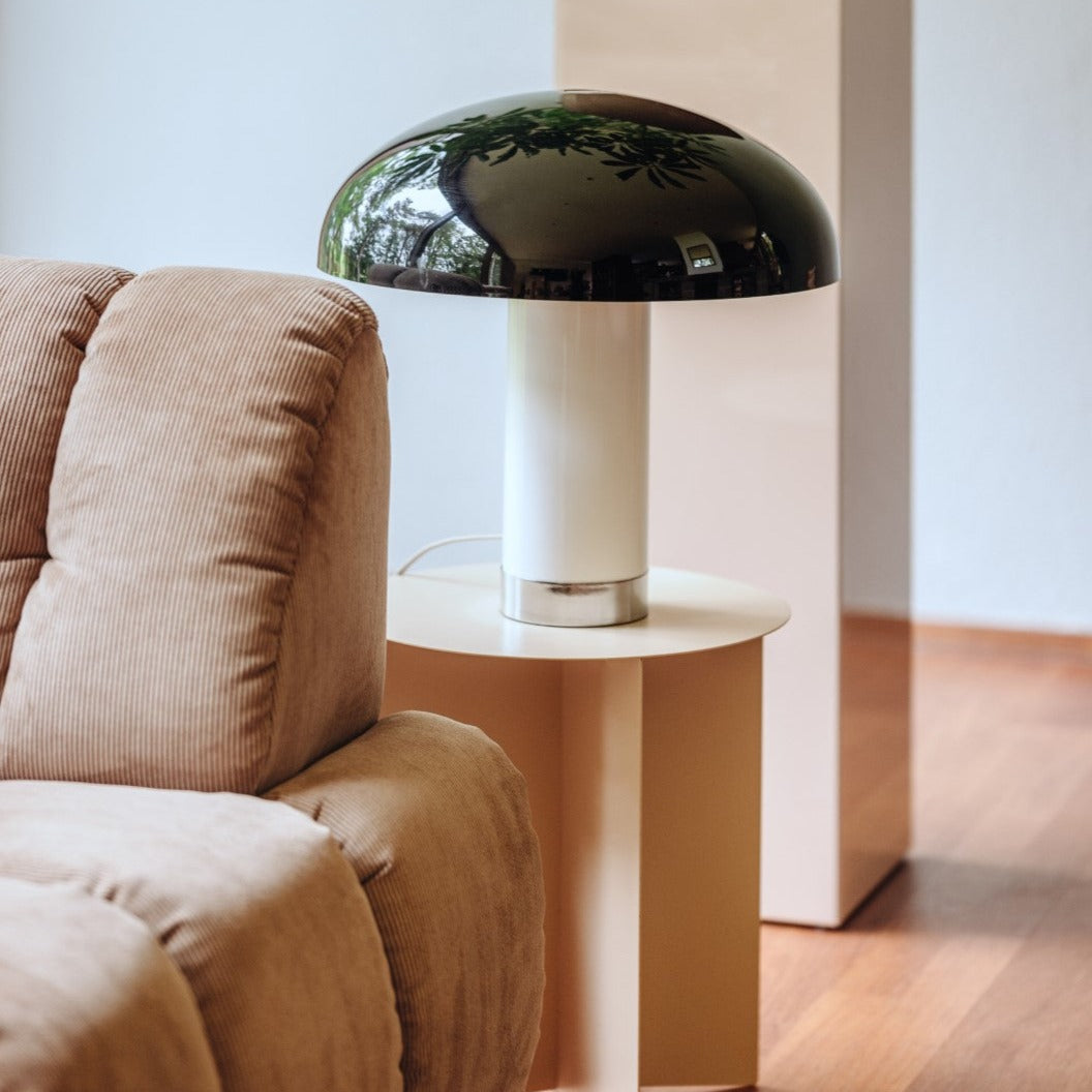 black white and chrome table lamp on a side table