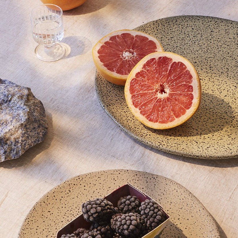 plates with grapefruit and blackberries