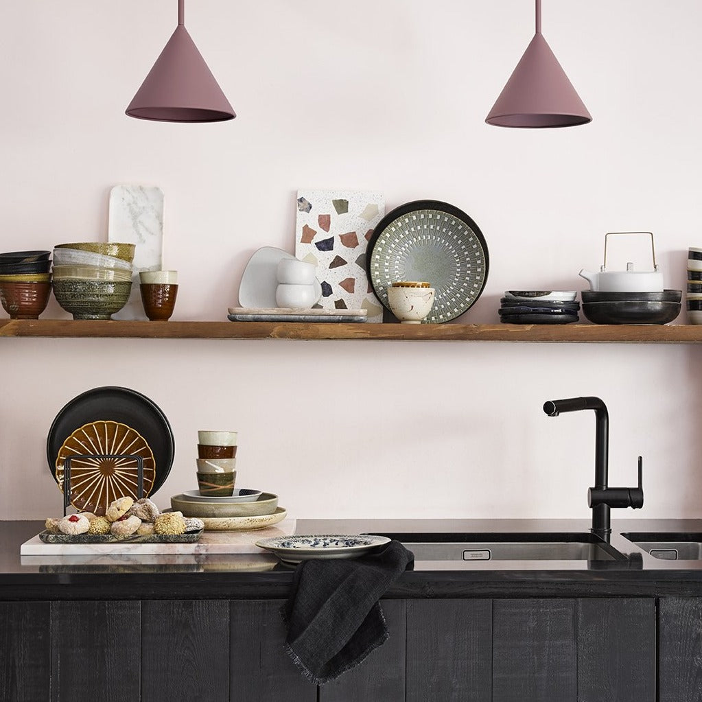 black rustic plates on open shelves