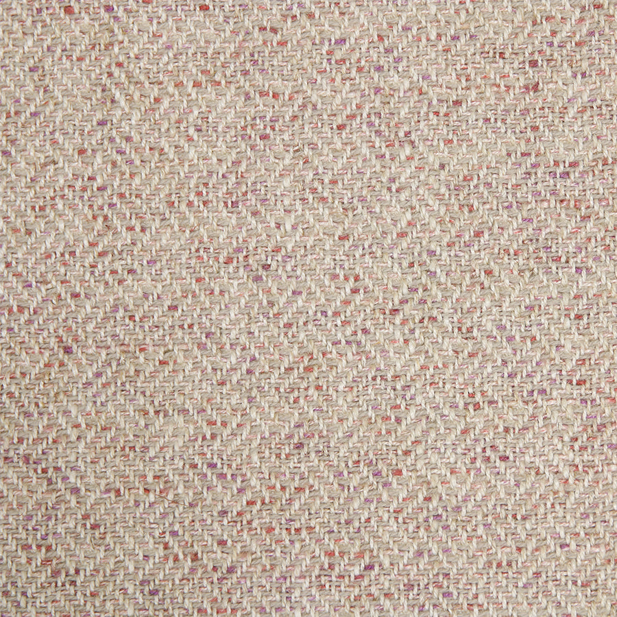 detail of fabric with a pink base and red purples and blush undertones