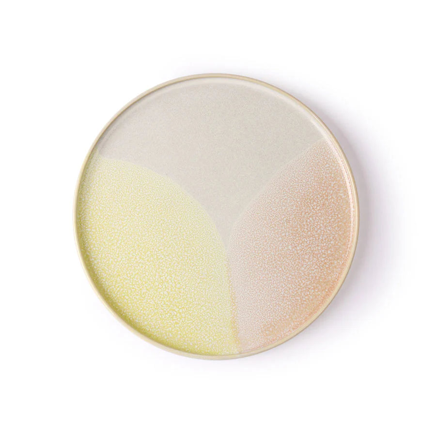 Round ceramic plate with gradient color on a white background