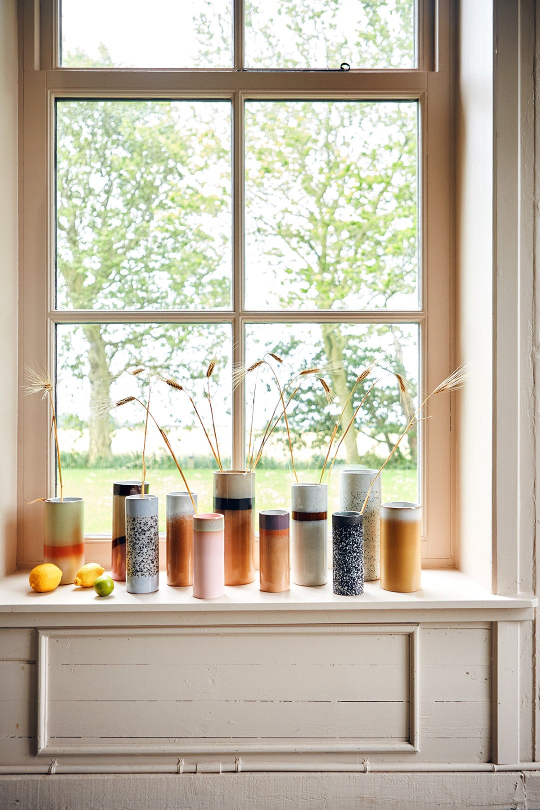 flower vases in a window setting