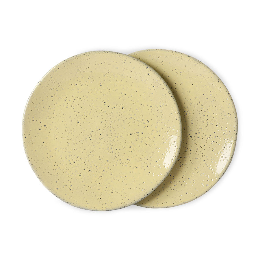 two ceramic plates in yellow with black speckles