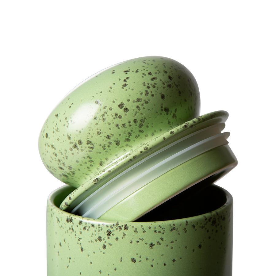 detail of green colored storage jar with silicone ring