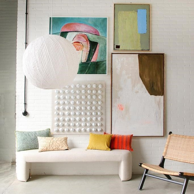 gallery wall with lobby bench and pillows