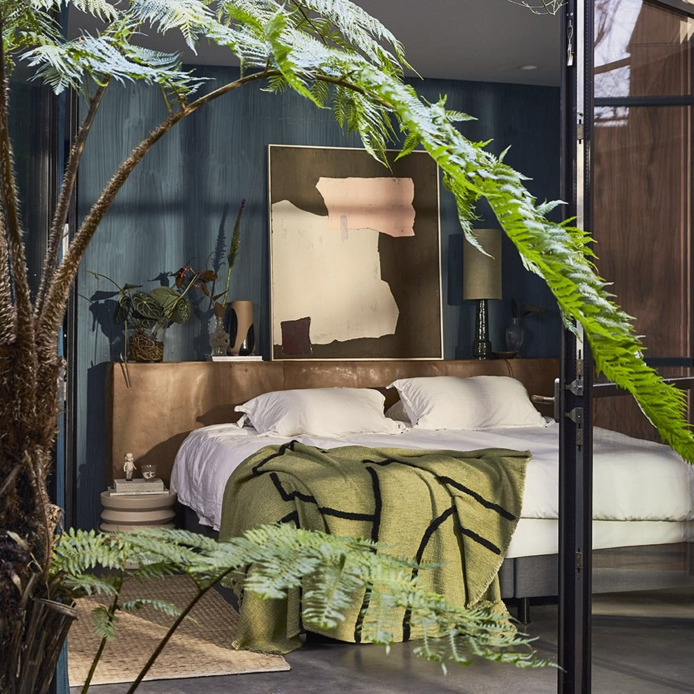 bedroom with pistachio green tufted throw blanket 