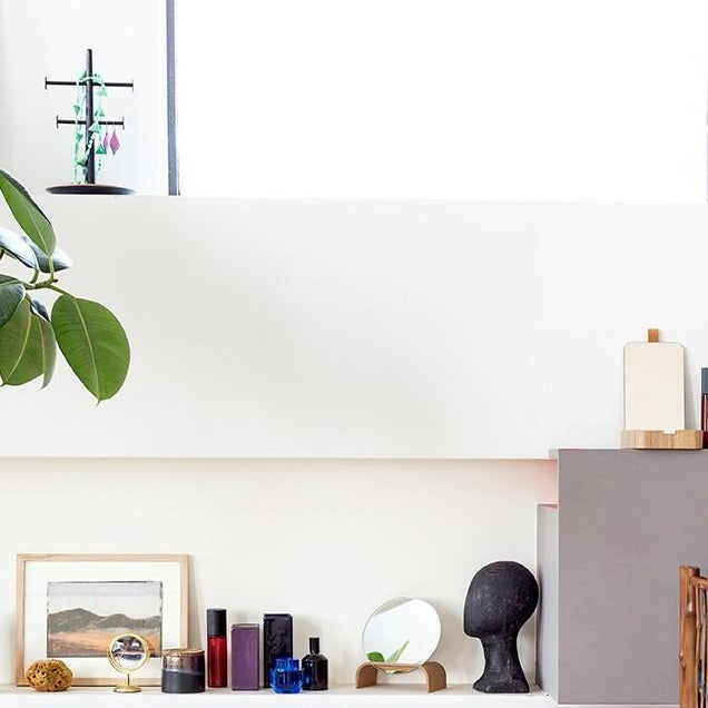 bathroom with willow wood accessories and perfume in glass bottles