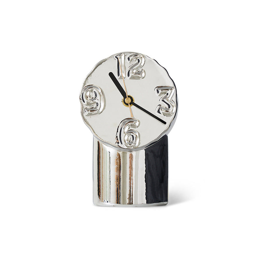 chrome colored ceramic clock with 4 numbers on a white background