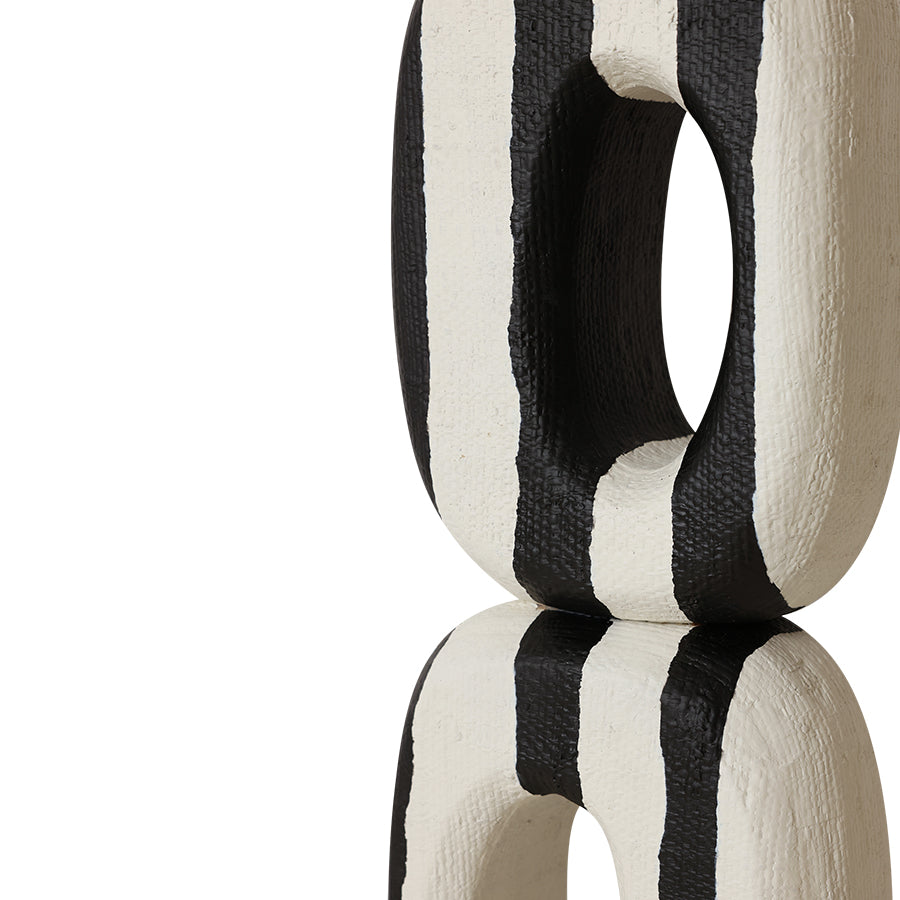 black and white sculpture on a white background