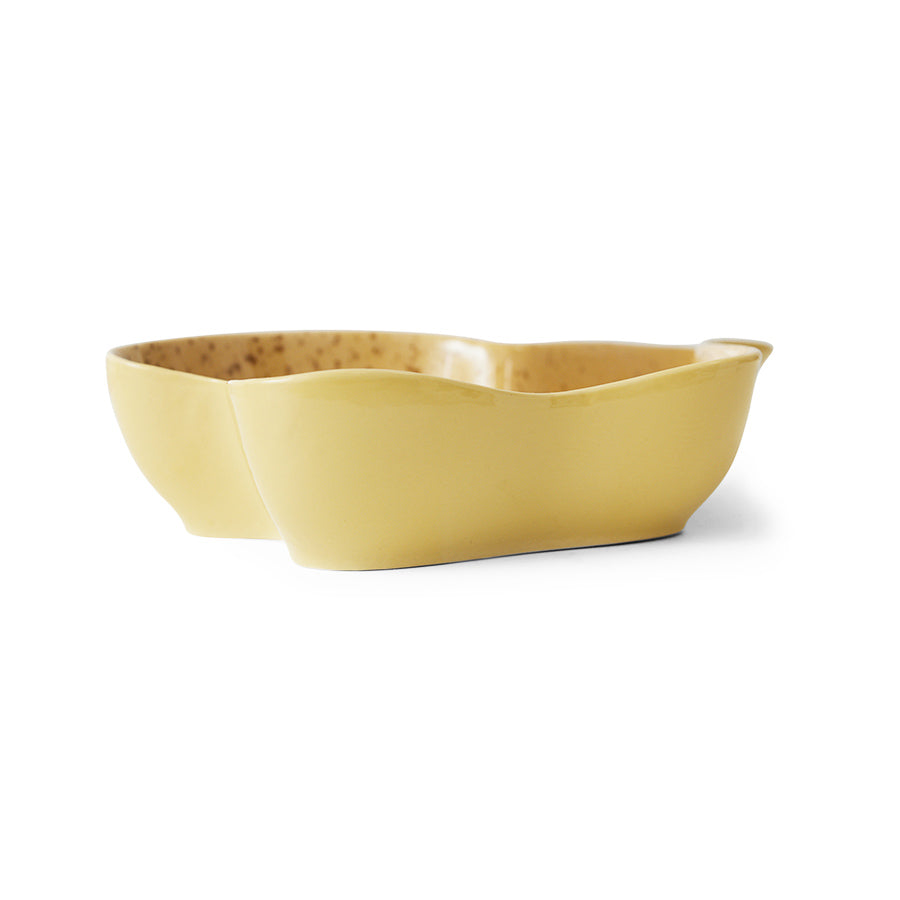 Yellow ceramic serving bowl on a white background