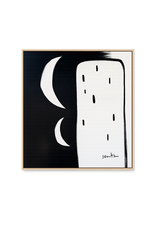 Abstract black and white artwork with moon phases in a gold frame.