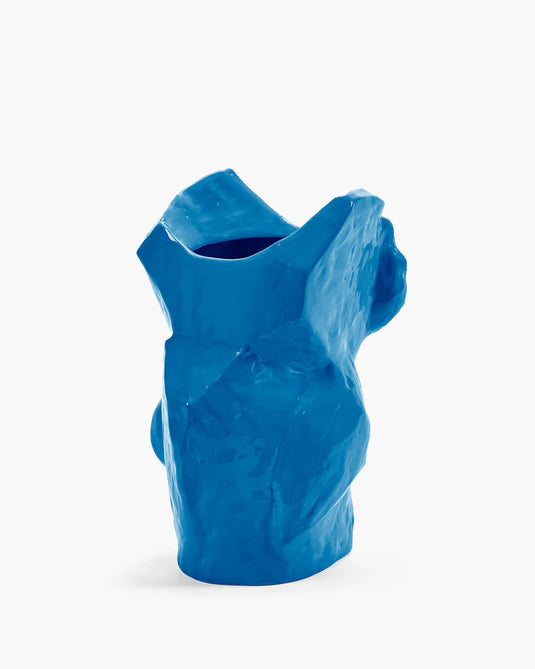Blue ceramic vase with abstract design on a white background