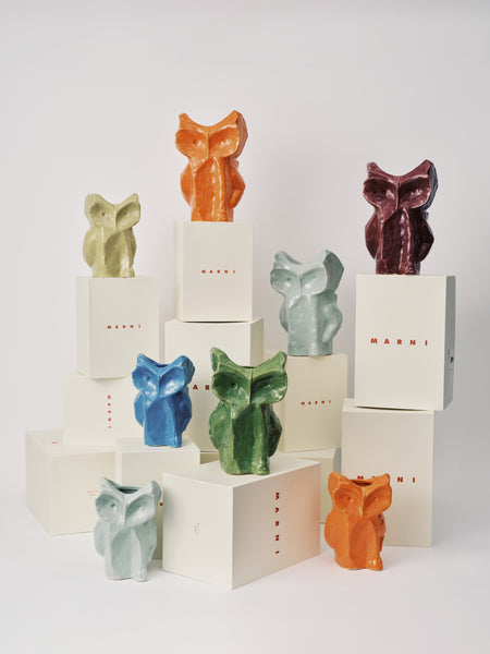 Colorful fox-shaped candles on white boxes with 'Marley' branding.
