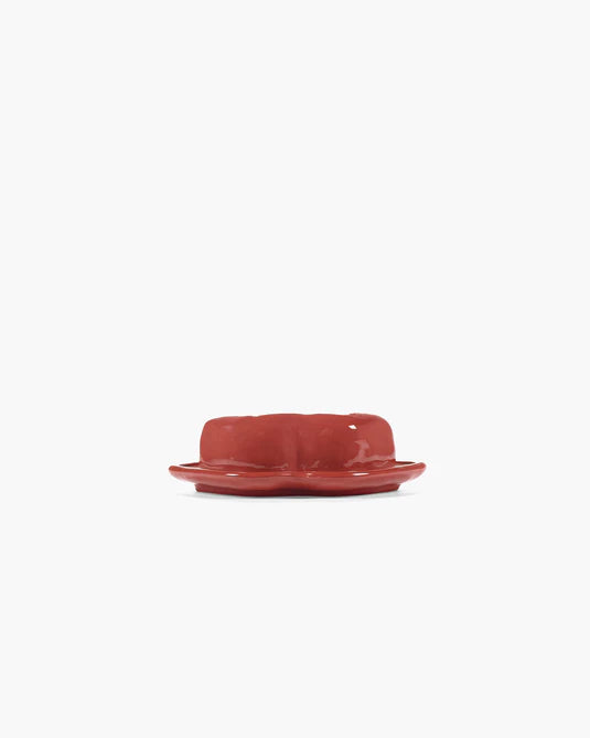 Red ceramic bowl on a white background