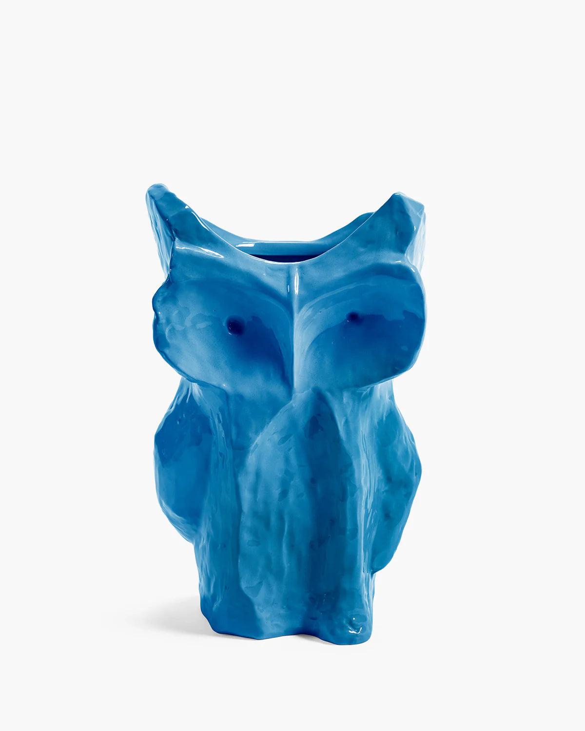 Blue ceramic owl-shaped vase on a white background