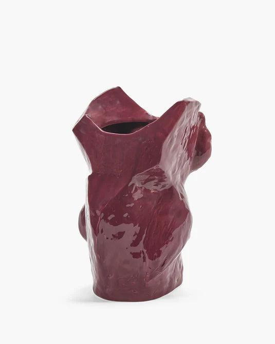 Maroon ceramic vase on a white background