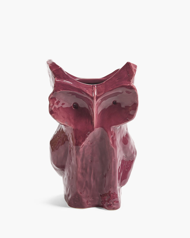 Ceramic owl-shaped vase on a white background