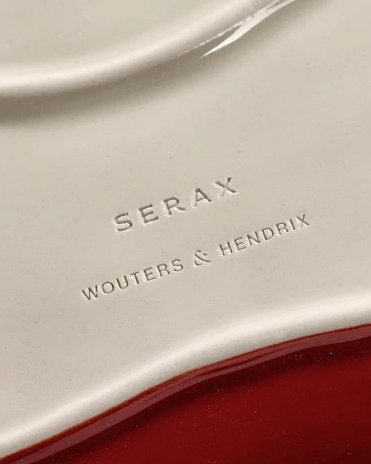 Close-up of a product with 'Serax Wouters & Hendrix' branding on a red and white background.