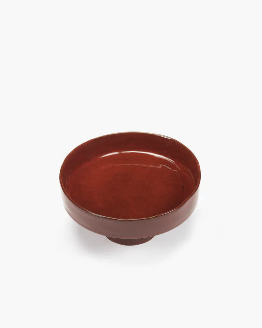 Red ceramic bowl on a white background