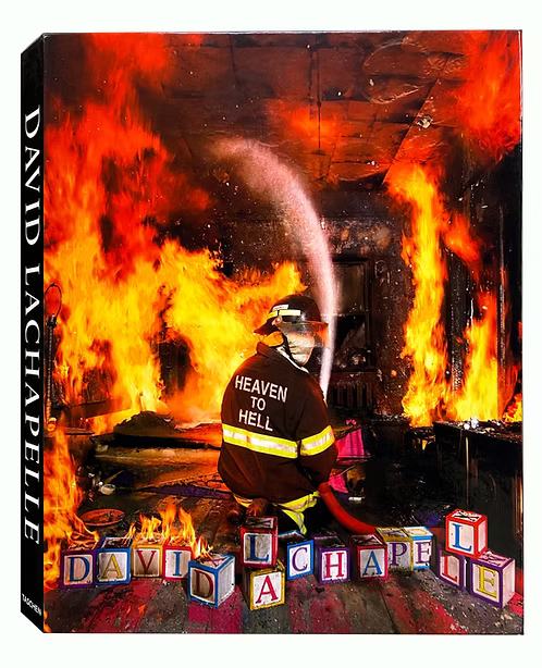 Book cover featuring a fireman in a burning building with flames and 'David Lachapelle' branding.