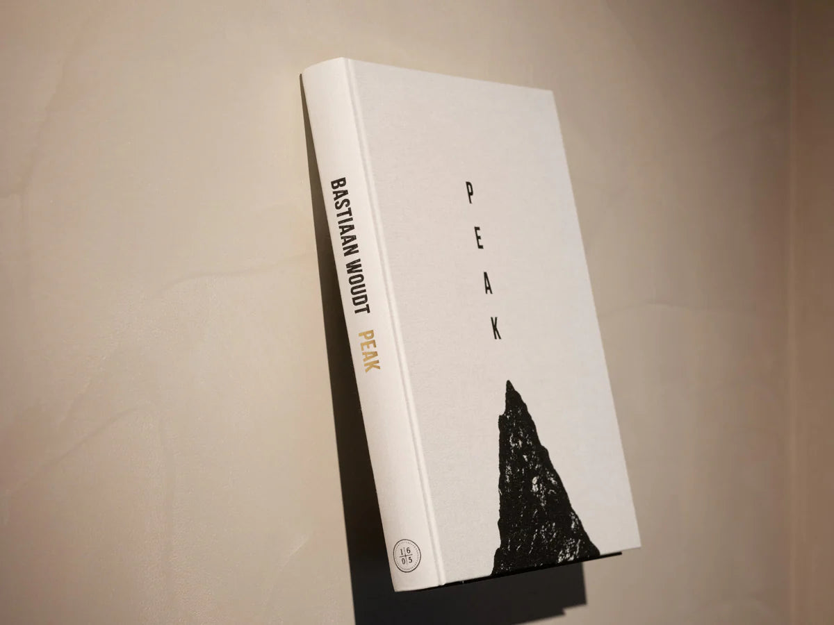 Book titled 'Peak' by Bastian Wood on a beige background