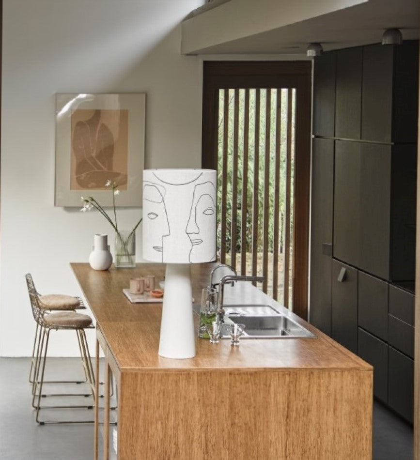 kitchen island with table lamp with faces 