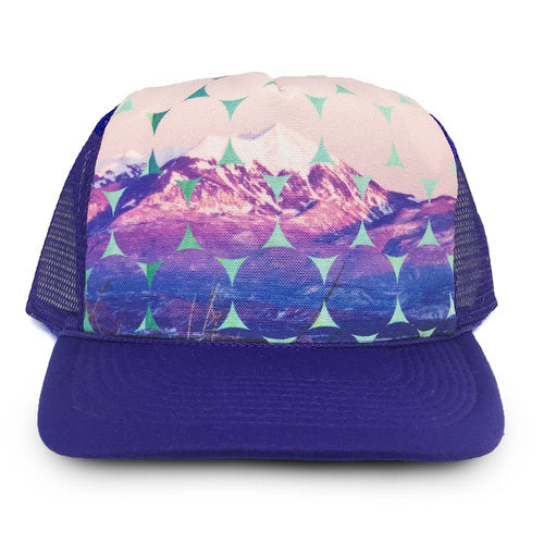 trucker hat with purple cap and fabric with image of moab mountain