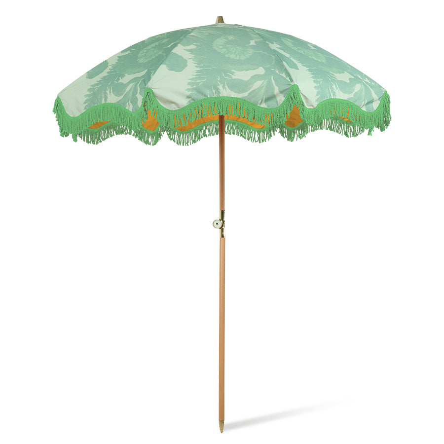 retro inspired beach umbrella in green with floral pattern and green fringes and wooden pole