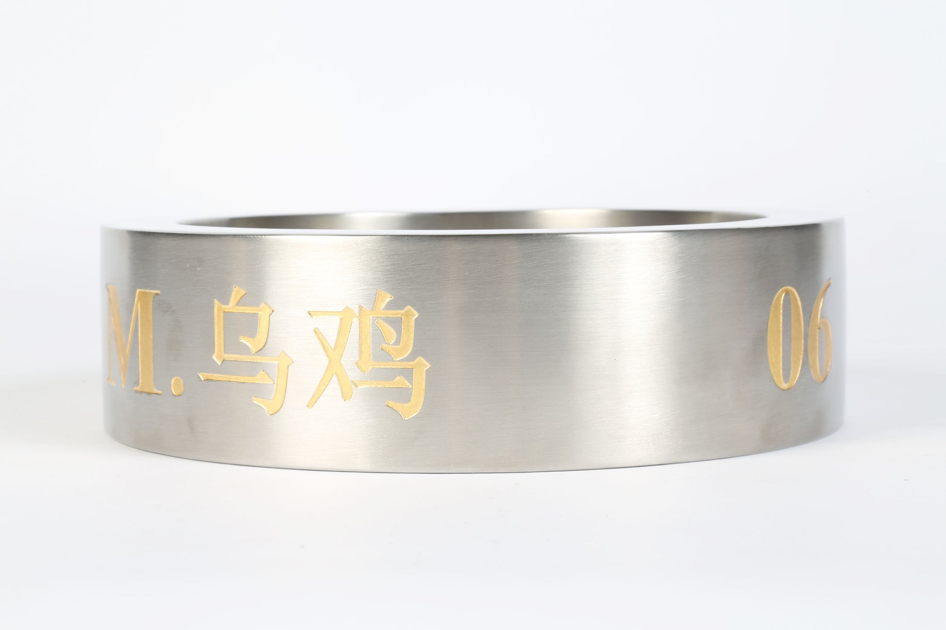 stainless steel ring with gold engraving