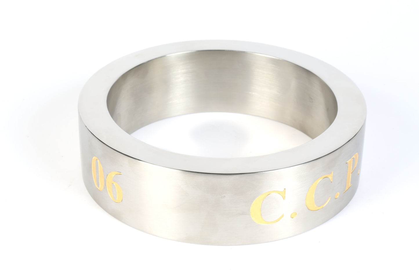 stainless steel ring sculpture with gold 