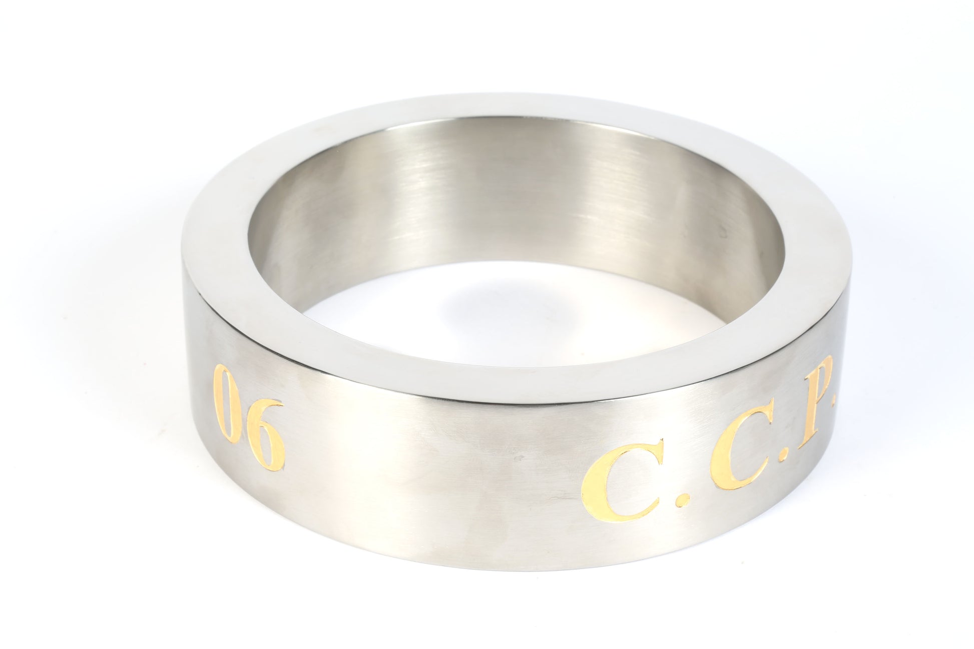 stainless steel ring sculpture with gold 