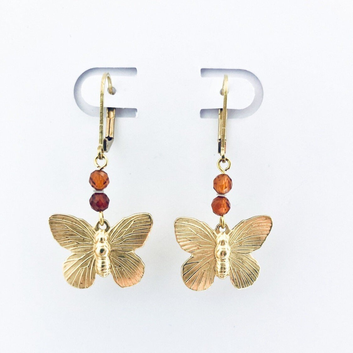 brass butterfly earrings with mandarin colored stones