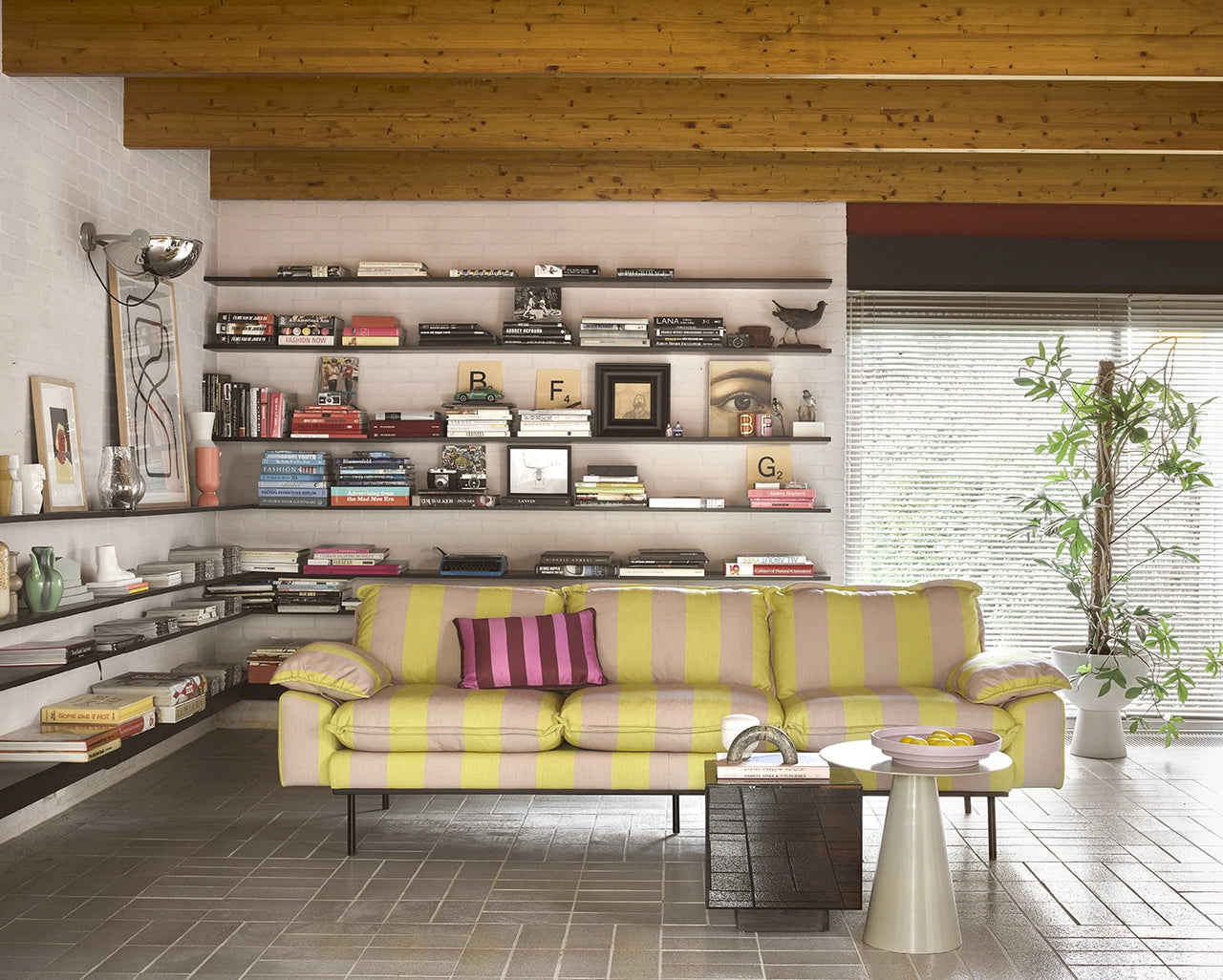 black mirror block table and striped sofa in a retro style interior