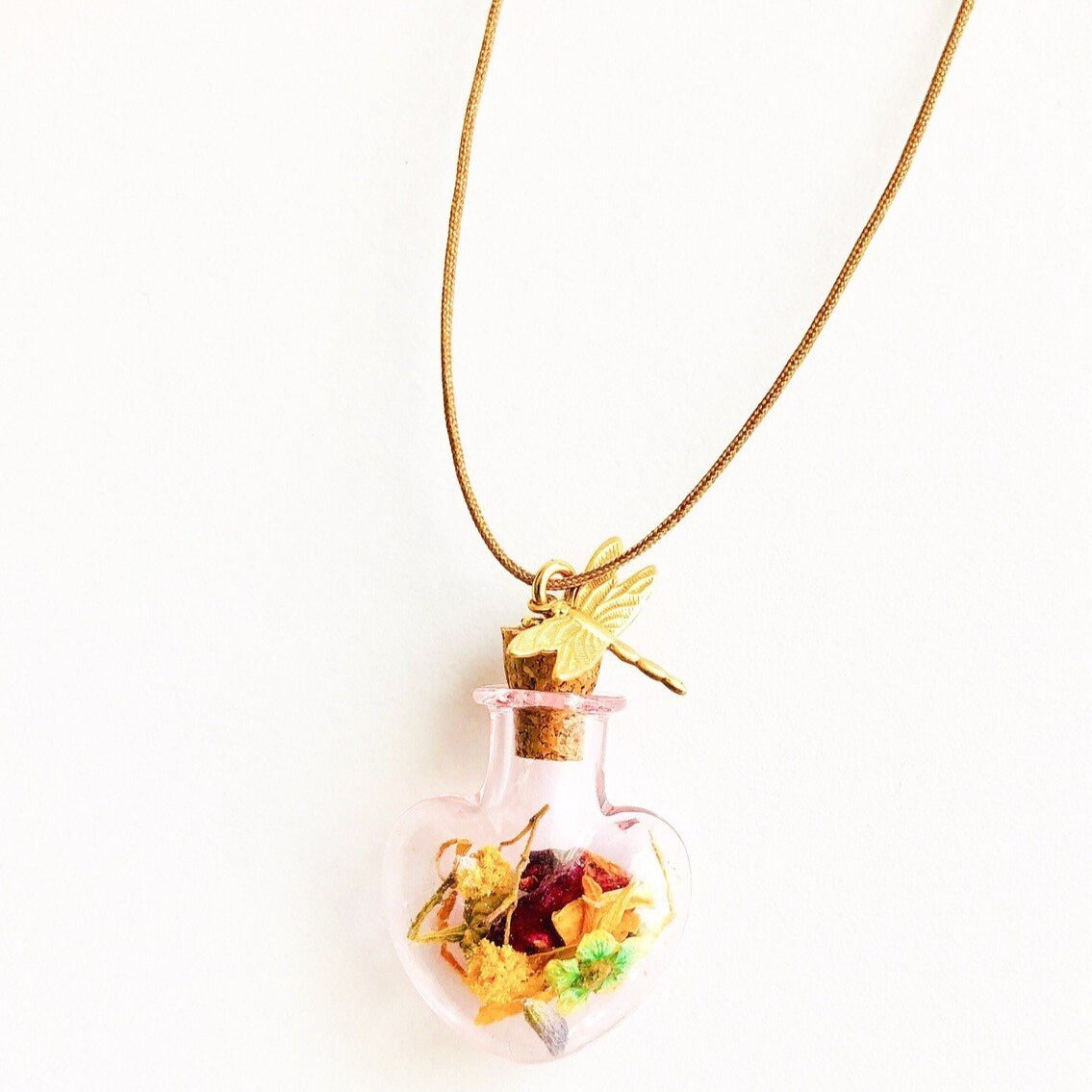 pink mini heart of glass with dried flowers and dragonfly