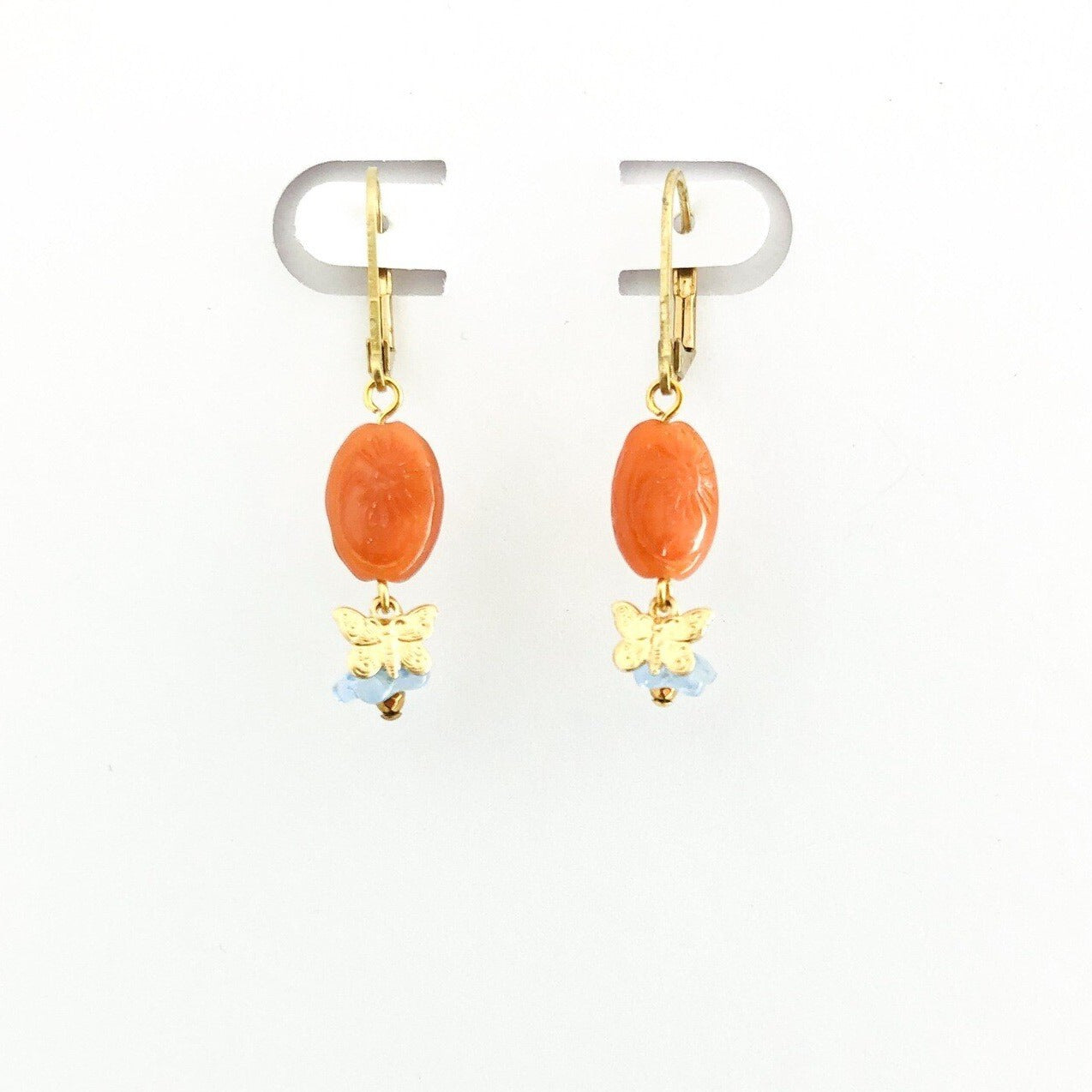 orange stone earrings with brass butterfly and blue flower