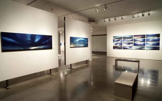 overview shot of museum style presentation supercell photo's in gallery