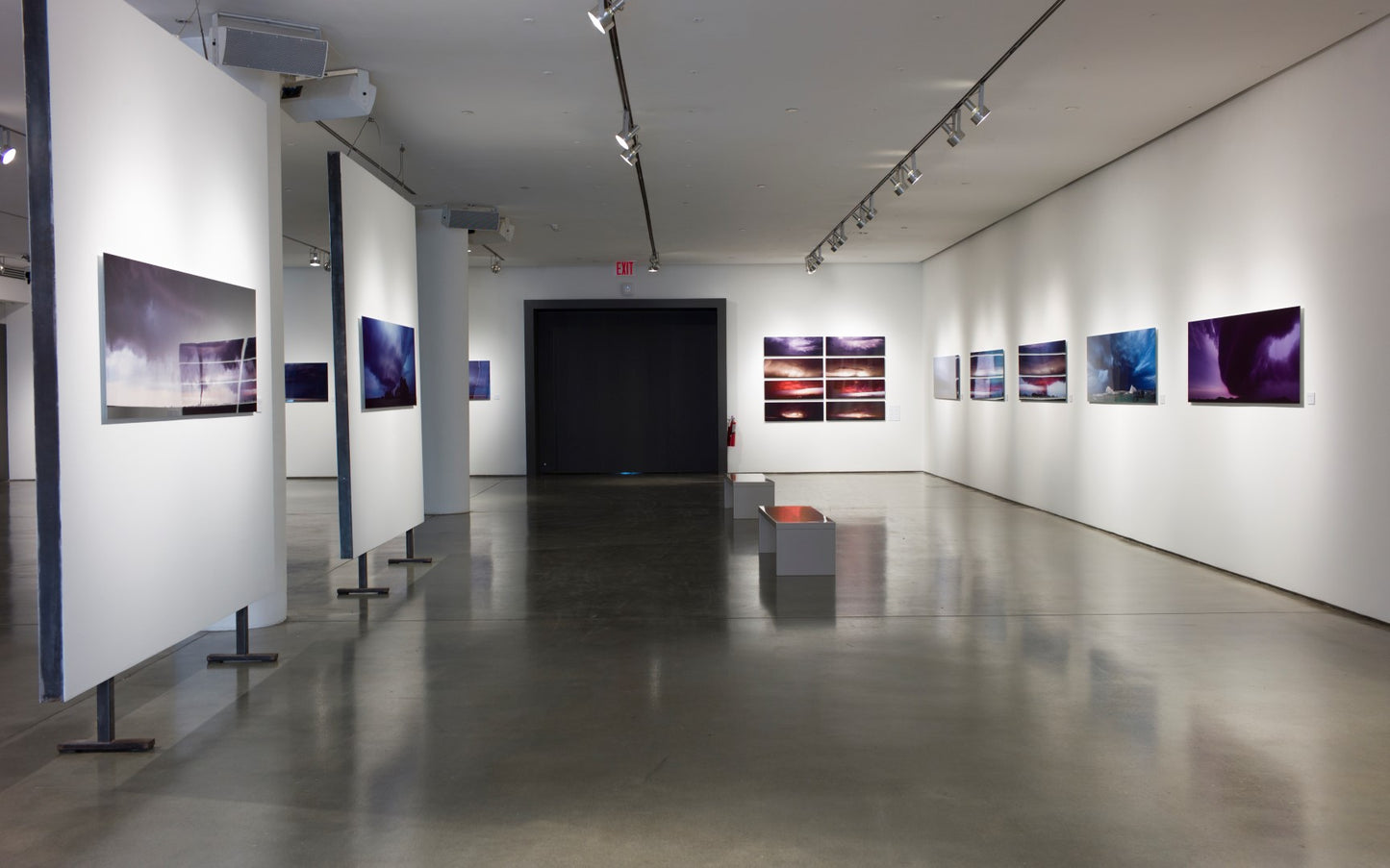 overview of a gallery exhibition of pictures of thunderstorms and supercells